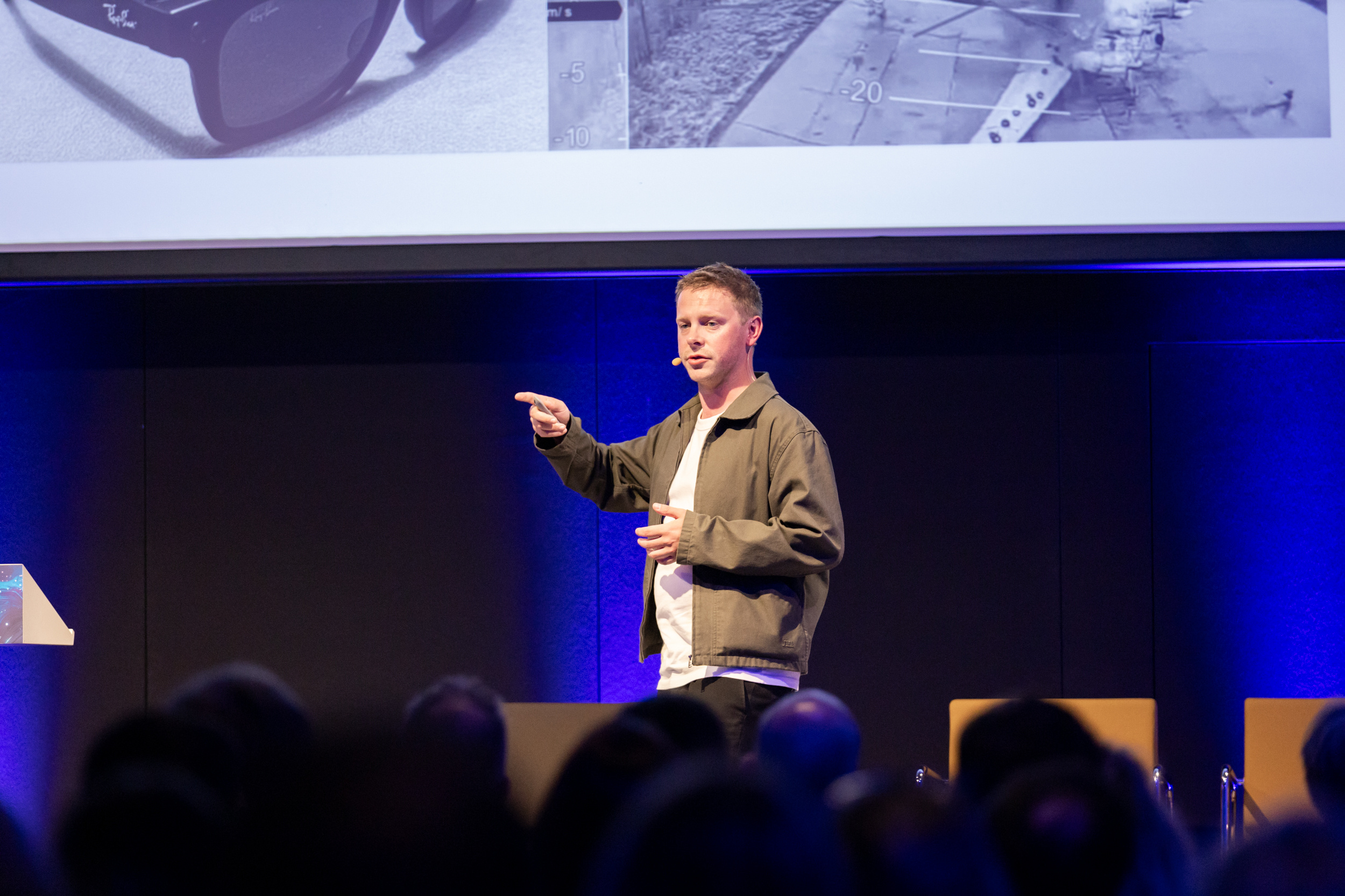 Elliot Leavy speaking on stage